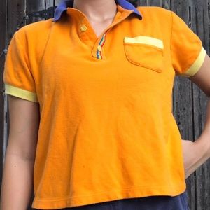 neon orange little kids polo with blue color and rainbow detail